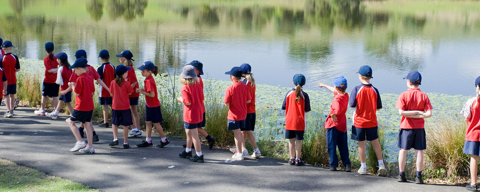 School children walking beside a lake at the Australian Botanic Garden Mount Annan