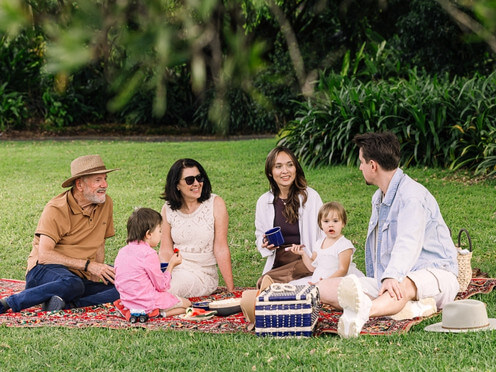 Family picnicking in a garden
