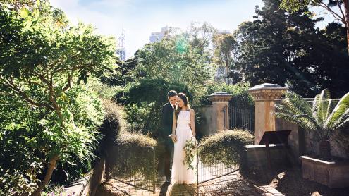 Bride and groom at rustic chic Lion Gate Lodge Garden gates