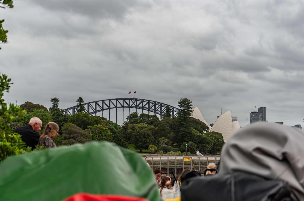 1 green and 1 grey beanbag in front of the view of Sydney Harbour Bridge and the Opera House that can be seen from the Mare & Foal Lawn.