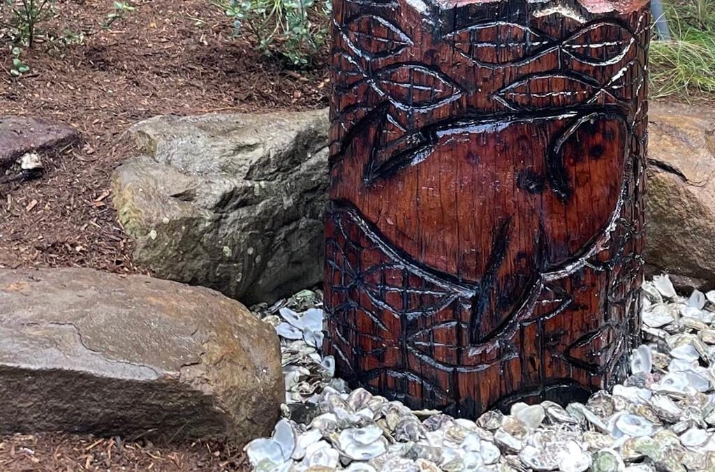 Whale carved into the base of the Yer'ung Spirit Tree