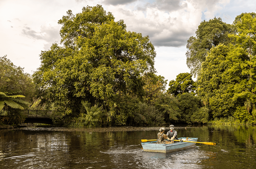 Two Wind in the Willows characters in a rowboat on the Main Pond